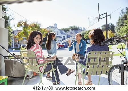 Stock Image - Happy family in garage. Fotosearch