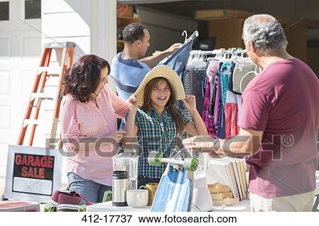 Multi-generation family at garage sale View Large Photo Image Stock Photo - Multi-generation family at garage sale. Fotosearch