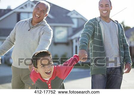 Multi-generation men laughing outdoors View Large Photo Image Stock Image - Multi-generation men laughing outdoors. Fotosearch