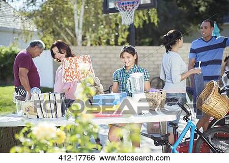 People shopping at yard sale View Large Photo Image Stock Photograph - People shopping at yard sale. Fotosearch