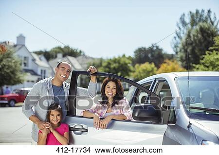 Portrait of family at car in driveway View Large Photo Image Picture - Portrait of family at car in driveway. Fotosearch