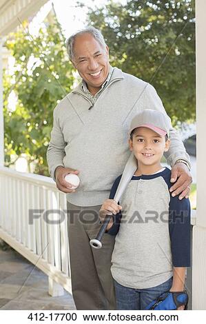 Portrait of grandfather and grandson with baseball and bat View Large Photo Image Stock Image - Portrait of grandfather and grandson with baseball and bat. Fotosearch