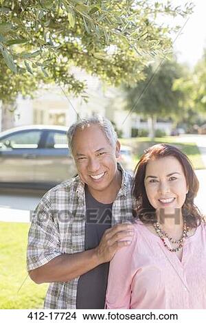 Portrait of smiling couple outdoors View Large Photo Image Picture - Portrait of smiling couple outdoors. Fotosearch