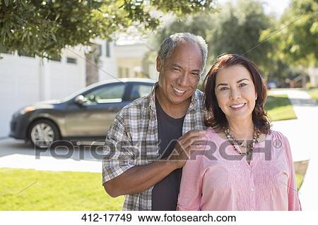 Portrait of smiling couple outdoors View Large Photo Image Stock Photo - Portrait of smiling couple outdoors. Fotosearch