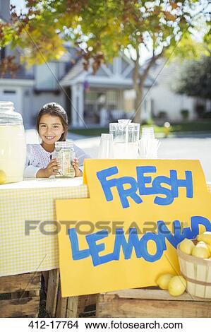 Portrait of smiling girl at lemonade stand View Large Photo Image Picture - Portrait of smiling girl at lemonade stand. Fotosearch