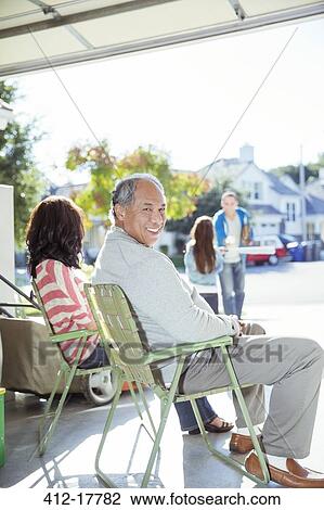 Portrait of smiling man in garage View Large Photo Image Stock Image - Portrait of smiling man in garage. Fotosearch