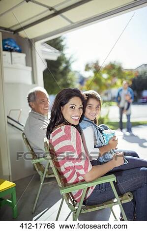 Portrait of smiling mother and daughter in garage View Large Photo Image Stock Photo - Portrait of smiling mother and daughter in garage. Fotosearch