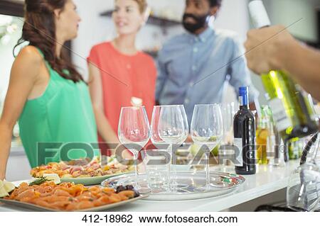 Food and wine on table at party View Large Photo Image Stock Image - Food and wine on table at party. Fotosearch