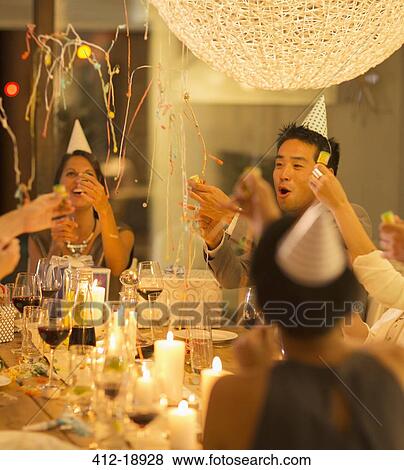 Friends celebrating at party View Large Photo Image Stock Photo - Friends celebrating at party. Fotosearch