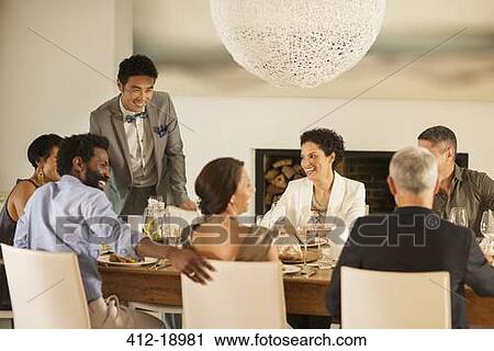 Friends talking at dinner party View Large Photo Image Stock Image - Friends talking at dinner party. Fotosearch