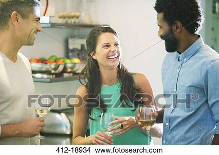 Friends talking at party View Large Photo Image Picture - Friends talking at party. Fotosearch