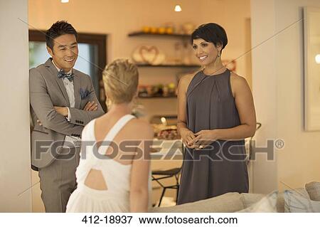 Friends talking at party View Large Photo Image Stock Photo - Friends talking at party. Fotosearch