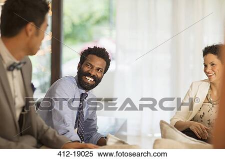 Friends talking at party View Large Photo Image Stock Photography - Friends talking at party. Fotosearch