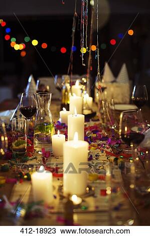 Lit candles on table at party View Large Photo Image Stock Image - Lit candles on table at party. Fotosearch