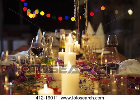 Lit candles on table at party View Large Photo Image Stock Image - Lit candles on table at party. Fotosearch