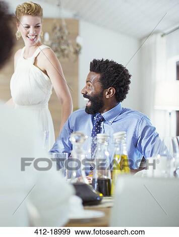 Man laughing at dinner party View Large Photo Image Stock Photo - Man laughing at dinner party. Fotosearch