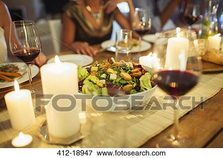 Salad bowl on table at dinner party View Large Photo Image Stock Photo - Salad bowl on table at dinner party. Fotosearch