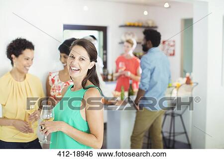 Stock Photograph - Woman laughing at party. Fotosearch