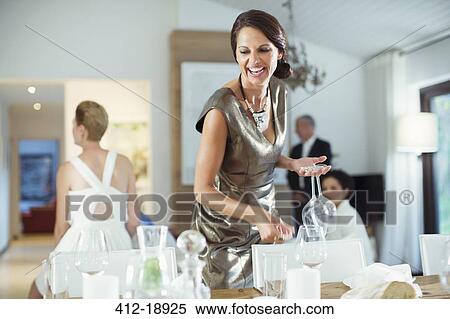 Woman setting table for party View Large Photo Image Stock Photography - Woman setting table for party. Fotosearch