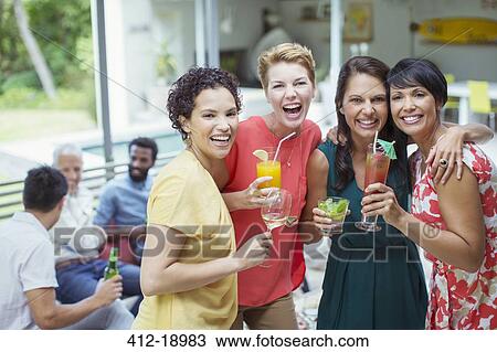 Women laughing at party View Large Photo Image Stock Image - Women laughing at party. Fotosearch