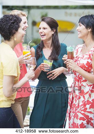 Women talking at party View Large Photo Image Stock Photo - Women talking at party. Fotosearch