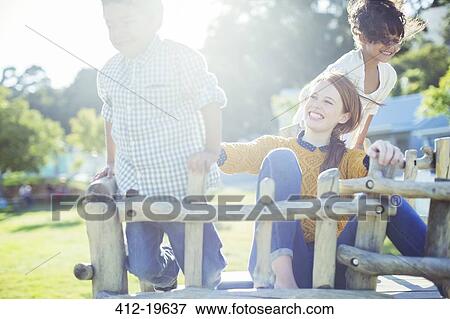 Babysitter and children playing outdoors View Large Photo Image Stock Photo - Babysitter and children playing outdoors. Fotosearch