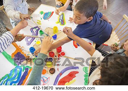 Children painting in class View Large Photo Image Stock Image - Children painting in class. Fotosearch