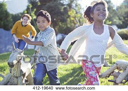 Children running in field View Large Photo Image Stock Image - Children running in field. Fotosearch