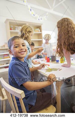 Student painting in classroom View Large Photo Image Stock Photo - Student painting in classroom. Fotosearch