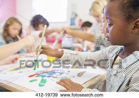 Student painting in classroom View Large Photo Image Stock Photo - Student painting in classroom. Fotosearch