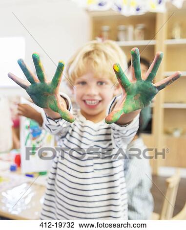 Student showing off messy hands in classroom View Large Photo Image Stock Image - Student showing off messy hands in classroom. Fotosearch