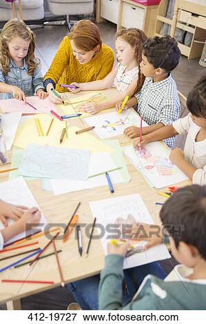 Students and teacher drawing in classroom View Large Photo Image Stock Photo - Students and teacher drawing in classroom. Fotosearch