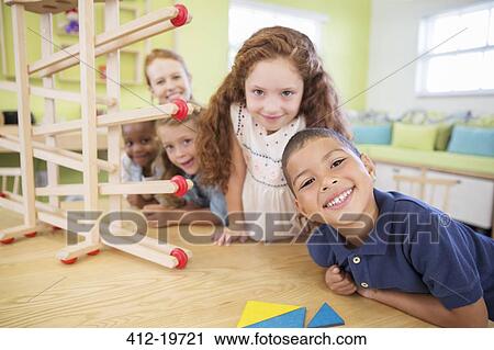 Students and teacher smiling in classroom View Large Photo Image Stock Image - Students and teacher smiling in classroom. Fotosearch