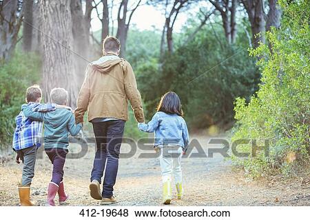 Students and teacher walking in forest View Large Photo Image Stock Photo - Students and teacher walking in forest. Fotosearch
