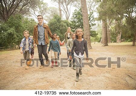 Students and teachers walking outdoors View Large Photo Image Stock Photography - Students and teachers walking outdoors. Fotosearch