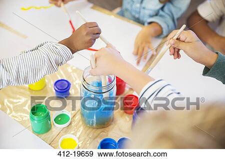 Stock Photo - Students painting in class. Fotosearch