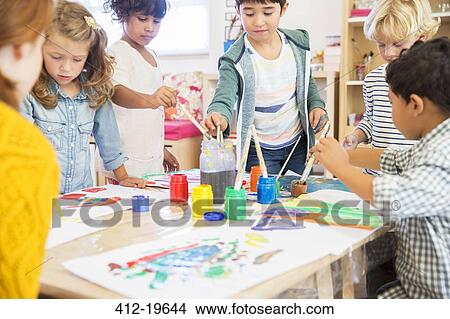 Students painting in classroom View Large Photo Image Picture - Students painting in classroom. Fotosearch