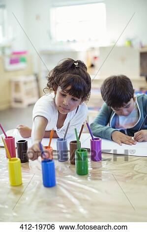 Students painting in classroom View Large Photo Image Stock Photograph - Students painting in classroom. Fotosearch