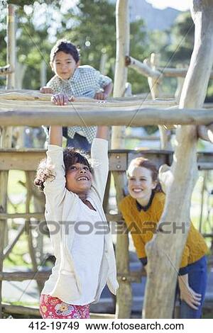 Teachers and students playing on play structure View Large Photo Image Stock Photo - Teachers and students playing on play structure. Fotosearch