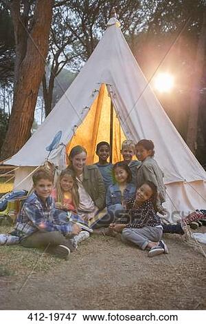 Teachers and students smiling at campsite View Large Photo Image Stock Photo - Teachers and students smiling at campsite. Fotosearch