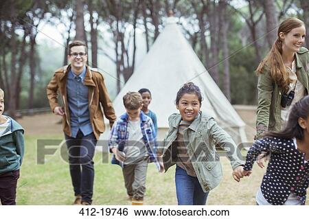 Teachers and students walking in forest View Large Photo Image Stock Photograph - Teachers and students walking in forest. Fotosearch