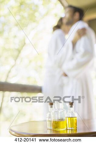 Bottles of massage oil on side table View Large Photo Image Stock Image - Bottles of massage oil on side table. Fotosearch
