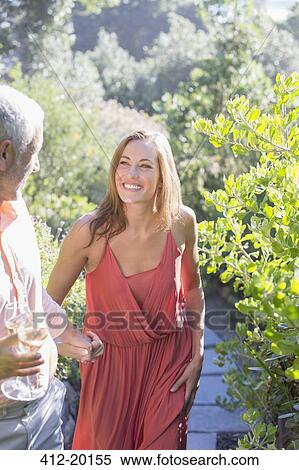 Couple having champagne together outdoors View Large Photo Image Stock Photography - Couple having champagne together outdoors. Fotosearch