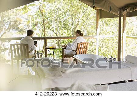 Couple relaxing together in spa View Large Photo Image Stock Image - Couple relaxing together in spa. Fotosearch