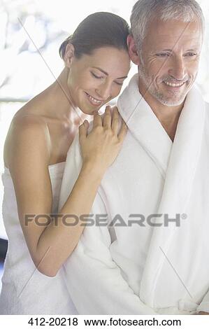 Stock Photo - Smiling couple hugging. Fotosearch