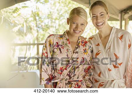 Smiling women wearing bathrobes View Large Photo Image Stock Image - Smiling women wearing bathrobes. Fotosearch