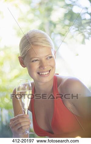 Woman drinking wine outdoors View Large Photo Image Stock Photo - Woman drinking wine outdoors. Fotosearch