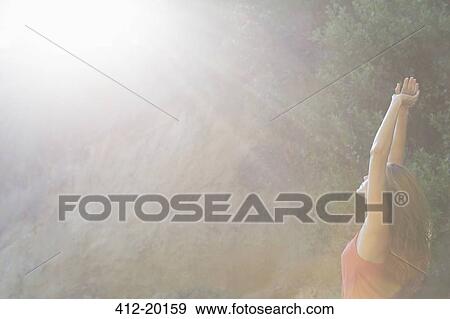 Stock Photo - Woman stretching outdoors. Fotosearch