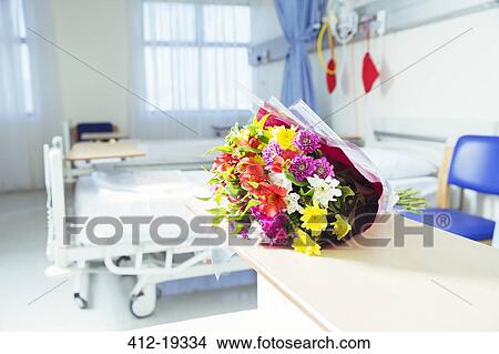 Bouquet of flowers in hospital room View Large Photo Image Picture - Bouquet of flowers in hospital room. Fotosearch
