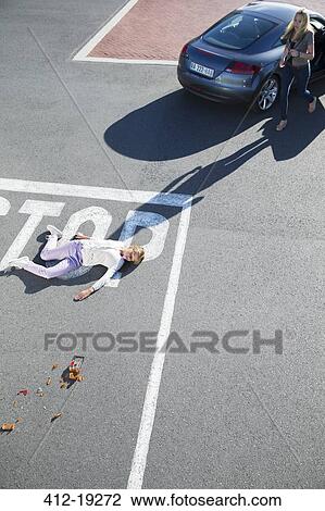 Driver rushing to injured girl on street View Large Photo Image Stock Image - Driver rushing to injured girl on street. Fotosearch
